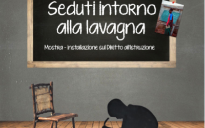 Seduti intorno alla lavagna al CFSI in occasione del seminario "Un mondo in classe"